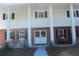 Brick home with a covered porch and double doors at 8700 Ross Ln, New Port Richey, FL 34654