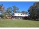 Two-story home with screened porch and large backyard at 8700 Ross Ln, New Port Richey, FL 34654