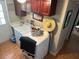 Functional laundry room with washer, dryer, sink, and ample storage space at 8700 Ross Ln, New Port Richey, FL 34654