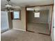 The living room features an open concept with ceiling fan at 8700 Ross Ln, New Port Richey, FL 34654