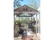 Outdoor grilling structure with grill and counter space, great for outdoor entertaining and summer barbecues at 8700 Ross Ln, New Port Richey, FL 34654