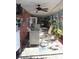 This large enclosed patio boasts decorative tiling, a ceiling fan and access to the outdoors at 8700 Ross Ln, New Port Richey, FL 34654