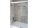 The bathroom boasts a shower and tub combination at 8700 Ross Ln, New Port Richey, FL 34654