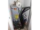 Utility closet with water heater and vacuum cleaner at 8700 Ross Ln, New Port Richey, FL 34654