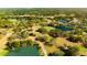 Aerial view of property near a golf course at 9053 Nakoma Way, Weeki Wachee, FL 34613