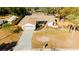 Aerial view of house showing the driveway and yard at 9053 Nakoma Way, Weeki Wachee, FL 34613