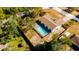 Aerial view of property showcasing the house and pool at 9053 Nakoma Way, Weeki Wachee, FL 34613