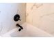 Bathroom with white marble tile and modern black fixtures at 9053 Nakoma Way, Weeki Wachee, FL 34613