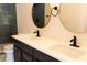 Double vanity bathroom with dark cabinets and white countertops at 9053 Nakoma Way, Weeki Wachee, FL 34613