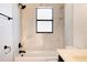 Bathroom with marble tile, bathtub, and single vanity at 9053 Nakoma Way, Weeki Wachee, FL 34613