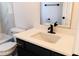 Single vanity bathroom with dark cabinets and white countertops at 9053 Nakoma Way, Weeki Wachee, FL 34613