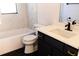 Bathroom with marble tile, bathtub, and single vanity at 9053 Nakoma Way, Weeki Wachee, FL 34613