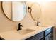 Double vanity bathroom with modern sinks and gold accents at 9053 Nakoma Way, Weeki Wachee, FL 34613