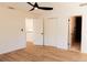 Spacious bedroom with hardwood floors and access to bathroom and kitchen at 9053 Nakoma Way, Weeki Wachee, FL 34613