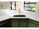 Modern kitchen sink and faucet with white quartz countertops at 9053 Nakoma Way, Weeki Wachee, FL 34613