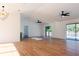 Open concept living room with hardwood floors and pool view at 9053 Nakoma Way, Weeki Wachee, FL 34613