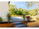 Relaxing pool area with lush landscaping and wooden planters at 9053 Nakoma Way, Weeki Wachee, FL 34613