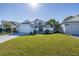 Single-Gathering home with a white garage door and landscaped yard at 1060 Vista Fina Ct, Spring Hill, FL 34608