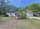 Single story home with a cactus and lush landscaping at 11015 Rollingwood Dr, Port Richey, FL 34668