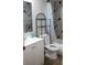 Clean bathroom with white vanity, shower/tub combo, and patterned tile at 11261 Redgate St, Spring Hill, FL 34609