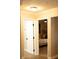 Bright hallway with doors leading to bedroom and other areas at 11261 Redgate St, Spring Hill, FL 34609