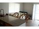 Kitchen with breakfast bar and view into living area at 11261 Redgate St, Spring Hill, FL 34609