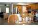Kitchen with breakfast bar, stainless steel appliances, and wood cabinets at 11261 Redgate St, Spring Hill, FL 34609