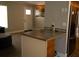 Kitchen with granite countertop island and wooden cabinets at 11261 Redgate St, Spring Hill, FL 34609