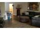 Spacious living room with a comfy sectional sofa and a large framed print at 11261 Redgate St, Spring Hill, FL 34609