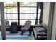 Relaxing screened porch with rocking chairs and outdoor seating at 11261 Redgate St, Spring Hill, FL 34609