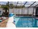 Refreshing swimming pool with screened enclosure at 11261 Redgate St, Spring Hill, FL 34609