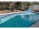 Clean swimming pool with screened enclosure at 11261 Redgate St, Spring Hill, FL 34609