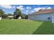 Expansive grassy backyard with shed and pool in the background at 12289 Glen Haven St, Spring Hill, FL 34609