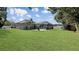 Large backyard with pool and screened enclosure, providing ample outdoor space at 12289 Glen Haven St, Spring Hill, FL 34609