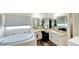 Large bathroom with double vanity and a jetted tub at 12289 Glen Haven St, Spring Hill, FL 34609