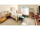 Cozy bedroom with a queen-size bed, and ample natural light at 12289 Glen Haven St, Spring Hill, FL 34609