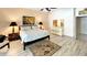Main bedroom with large bed and hardwood flooring at 12289 Glen Haven St, Spring Hill, FL 34609
