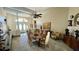 Formal dining room with a large wooden table and ample seating at 12289 Glen Haven St, Spring Hill, FL 34609