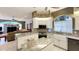 Modern kitchen with white cabinets, granite countertops, and a large island at 12289 Glen Haven St, Spring Hill, FL 34609