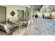 Inviting pool area with patio furniture and screened enclosure at 12289 Glen Haven St, Spring Hill, FL 34609