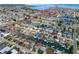 Aerial view of waterfront homes with boat docks and canal access in a coastal community marked with red path to open water at 13639 Frances Ave, Hudson, FL 34667