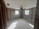 Bedroom featuring exposed walls with two windows, offering a customizable space for renovation and personalization at 13639 Frances Ave, Hudson, FL 34667
