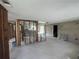 Living room showcasing exposed walls offering a customizable space for renovation and personalization at 13639 Frances Ave, Hudson, FL 34667