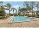 Refreshing community pool with lounge chairs and patio area at 230 Thorn Tree Pl # 230, Brandon, FL 33510