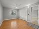Bedroom boasts wood floors, large closet, and a sunny window at 230 Thorn Tree Pl # 230, Brandon, FL 33510