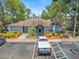 Community clubhouse featuring an awning entry, manicured landscaping and convenient parking at 230 Thorn Tree Pl # 230, Brandon, FL 33510