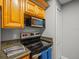 Well-appointed kitchen: stainless steel oven and microwave, granite countertops, providing a practical and modern cooking space at 230 Thorn Tree Pl # 230, Brandon, FL 33510
