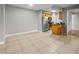 Spacious living area open to the kitchen, with tile flooring creating an inviting and connected living space at 230 Thorn Tree Pl # 230, Brandon, FL 33510
