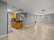 Open floor plan, tile floors, view into kitchen with stainless steel refrigerator at 230 Thorn Tree Pl # 230, Brandon, FL 33510