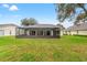 Spacious backyard with screened pool and patio at 2362 Whisper Walk Dr, Spring Hill, FL 34606